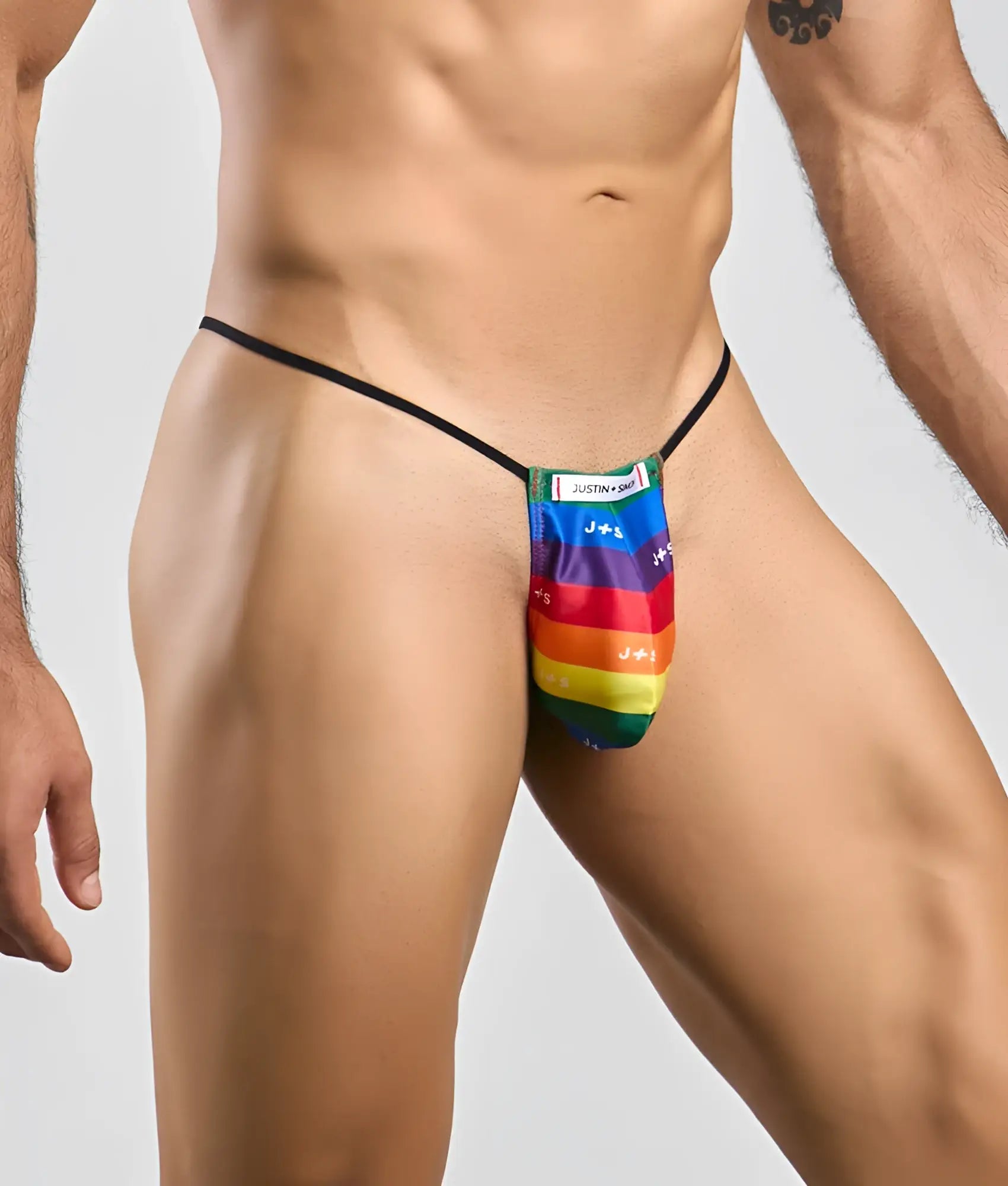 Justin Simon classic g-string bulge with rainbow-striped fabric thong and black elastic waistband featuring brand label