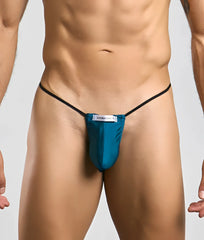 Teal justin simon classic g-string bulge with black elastic straps and white brand label front view