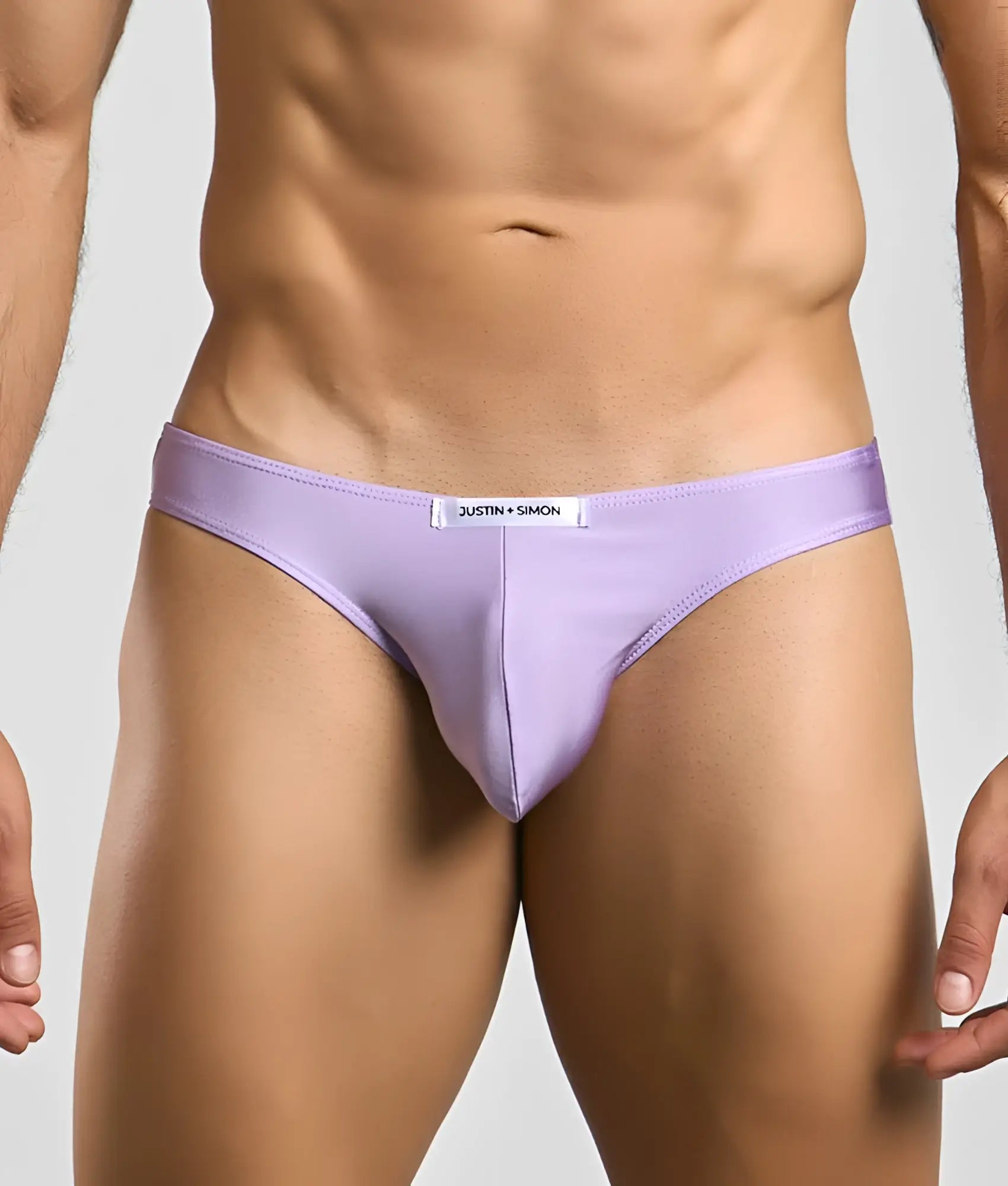 Lavender-colored justin simon classic mens bikini briefs with a sleek form-fitting design and subtle brand tag at waistband
