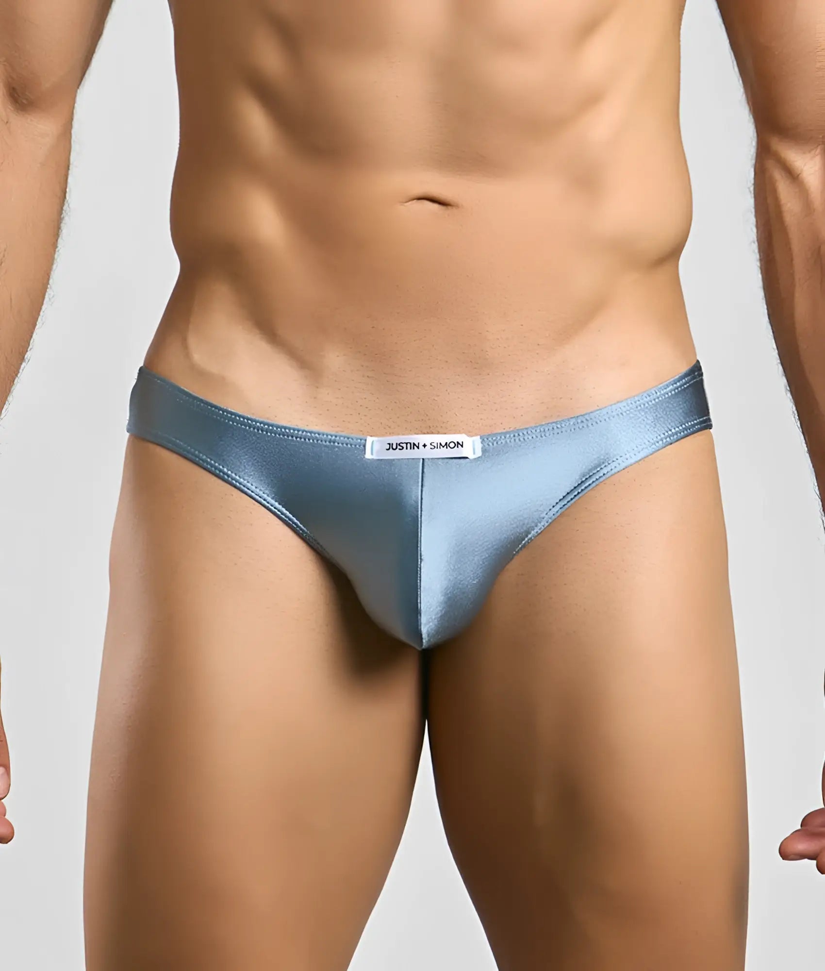 Justin + Simon classic mens bikini light blue satin briefs with sleek form-fitting design and white brand tag at waistband