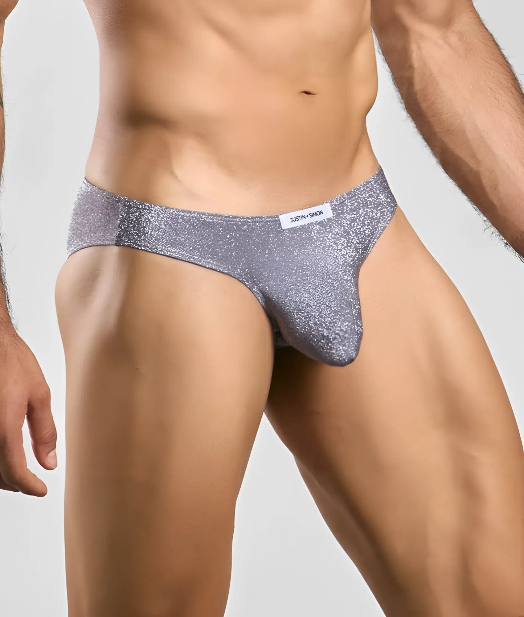 Silver glittery briefs with a snug form-fitting design from justin + simon classic mens bikini collection