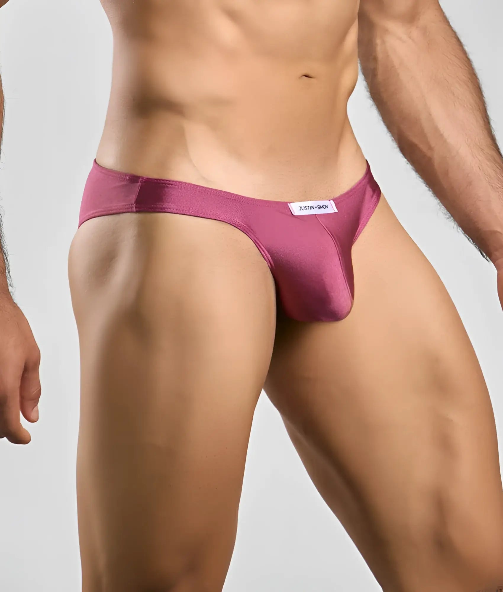 Justin + Simon classic mens bikini brief in sleek magenta satin with minimalist design and white brand tag at waistband