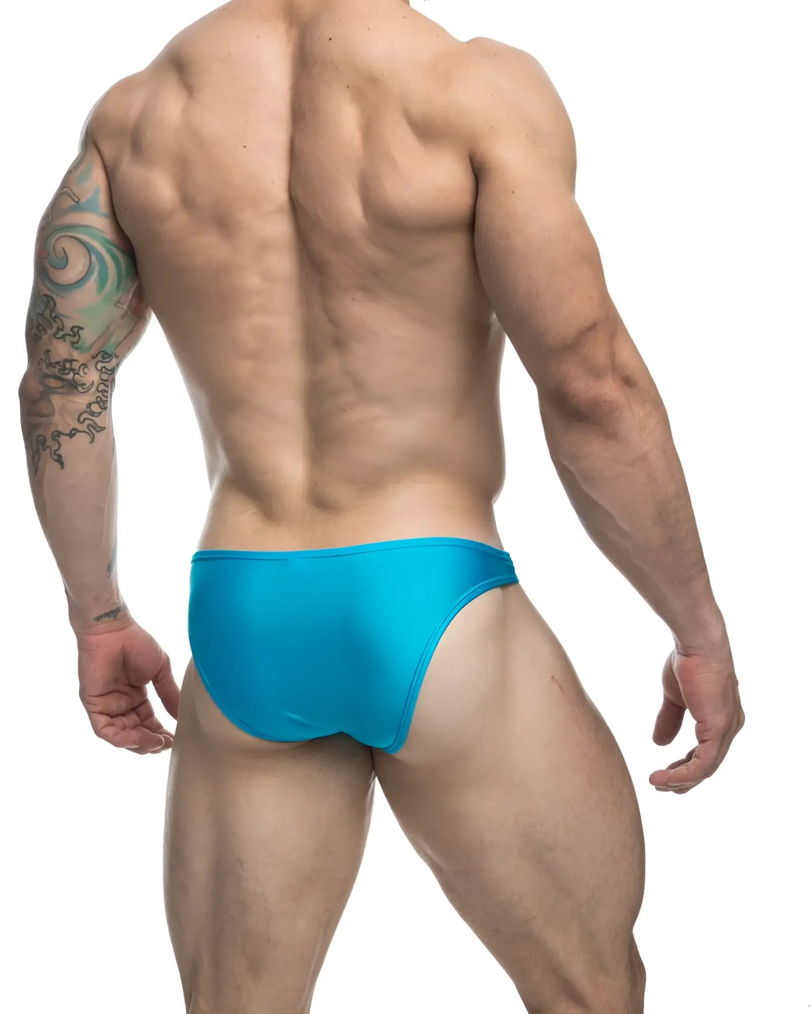Bright turquoise justin simon classic bikini swim trunks with a sleek form fitting design ideal for swimming