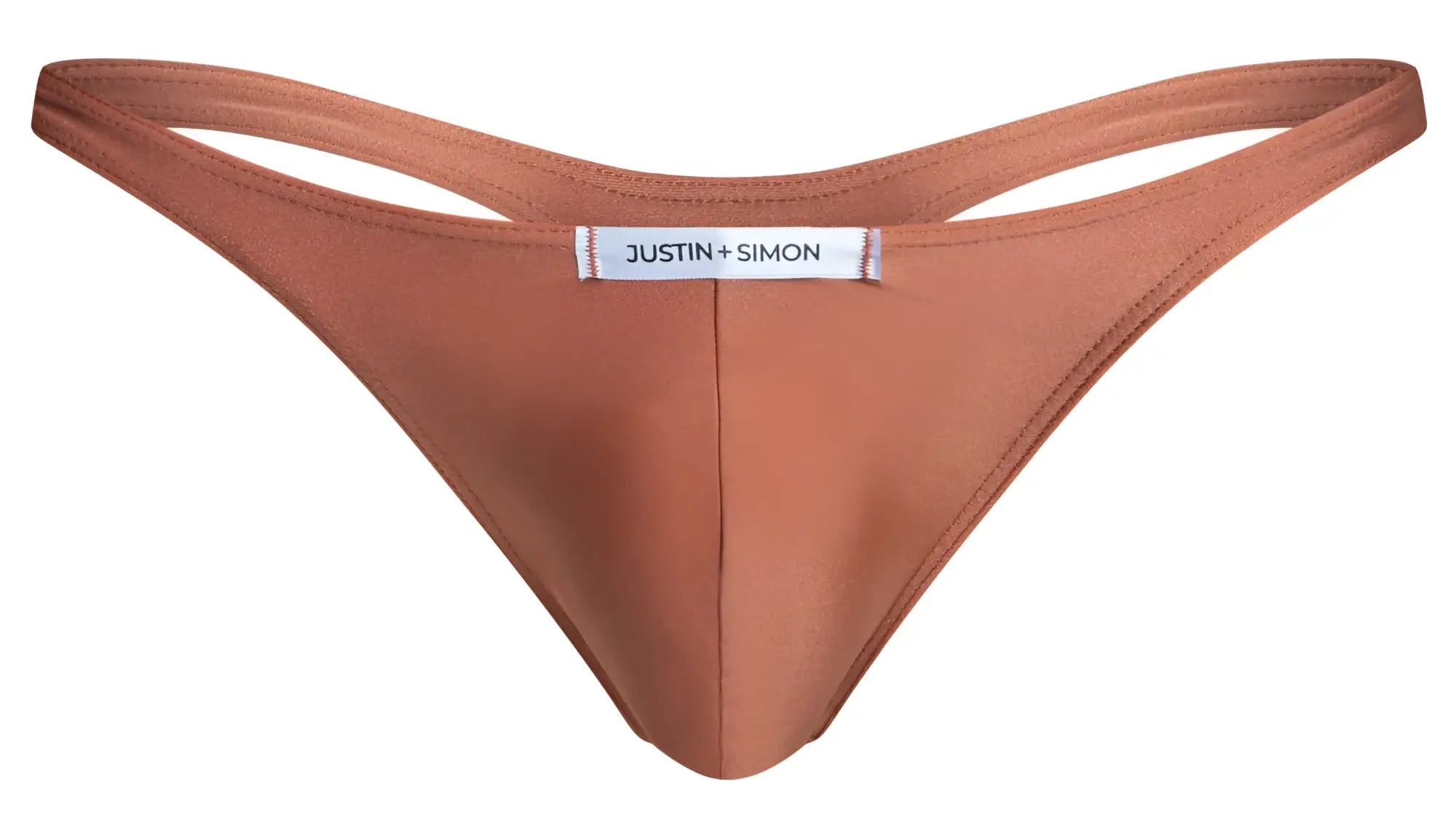 A sleek rust-colored thong made of smooth fabric with minimalist design and justin plus simon label at center