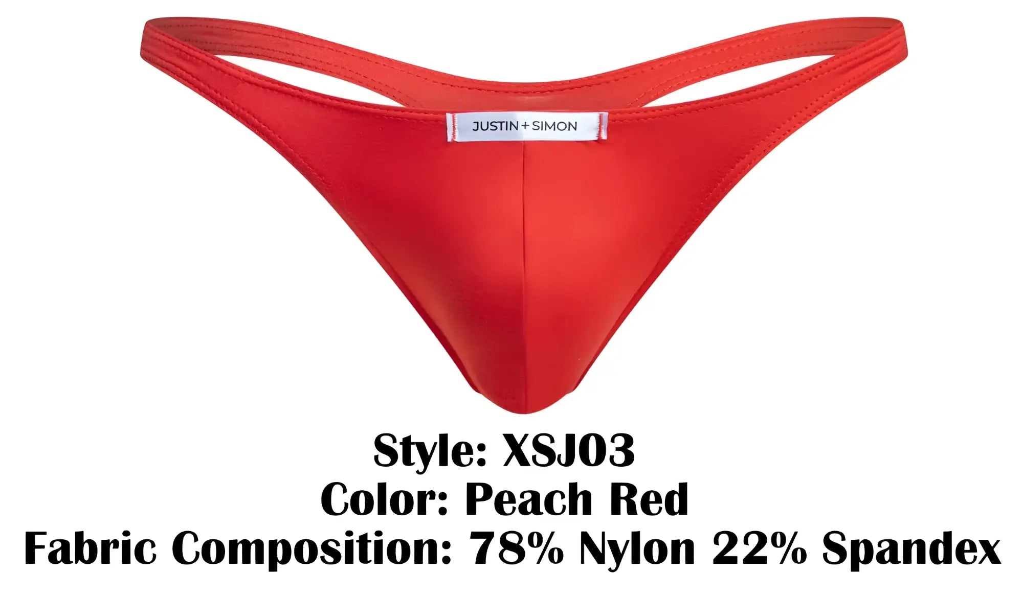 A vibrant peach red classic thong by justin + simon made of stretchy nylon and spandex with brand label at center