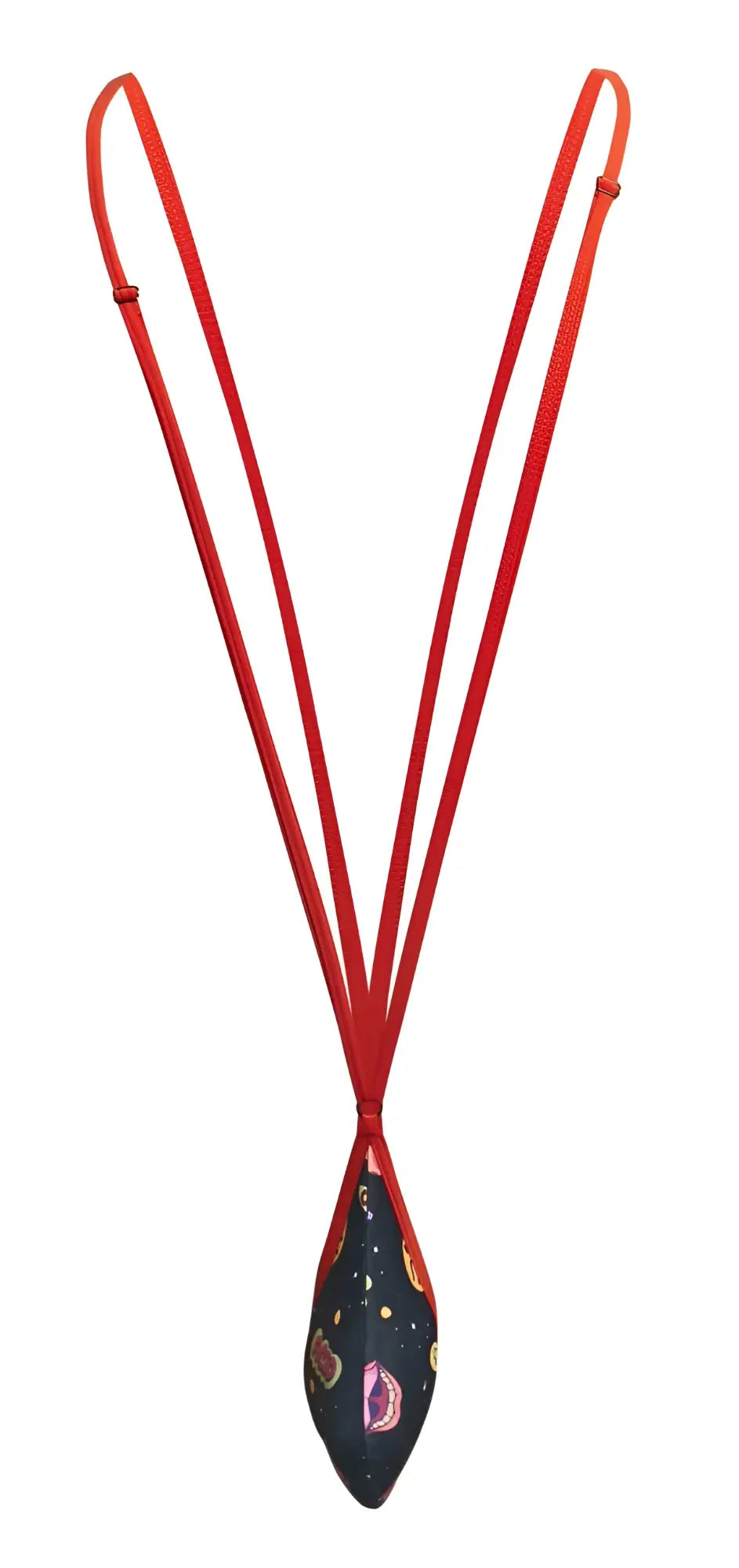 A vibrant red corded necklace with a teardrop pendant featuring dark navy fabric with colorful paisley and star patterns