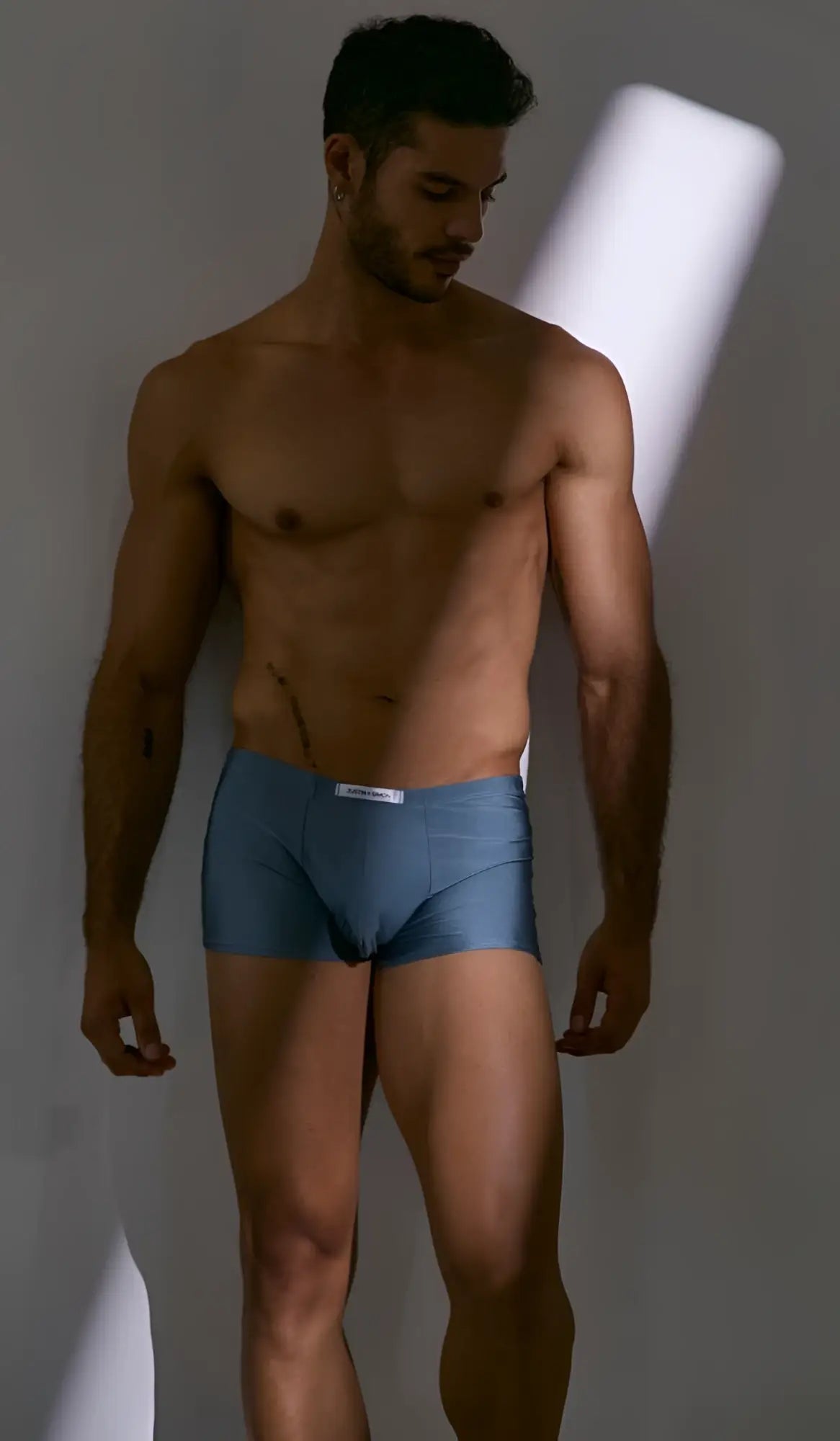 Blue cotton briefs with white waistband label from justin+simon xsj08 classic boxer in metal green color