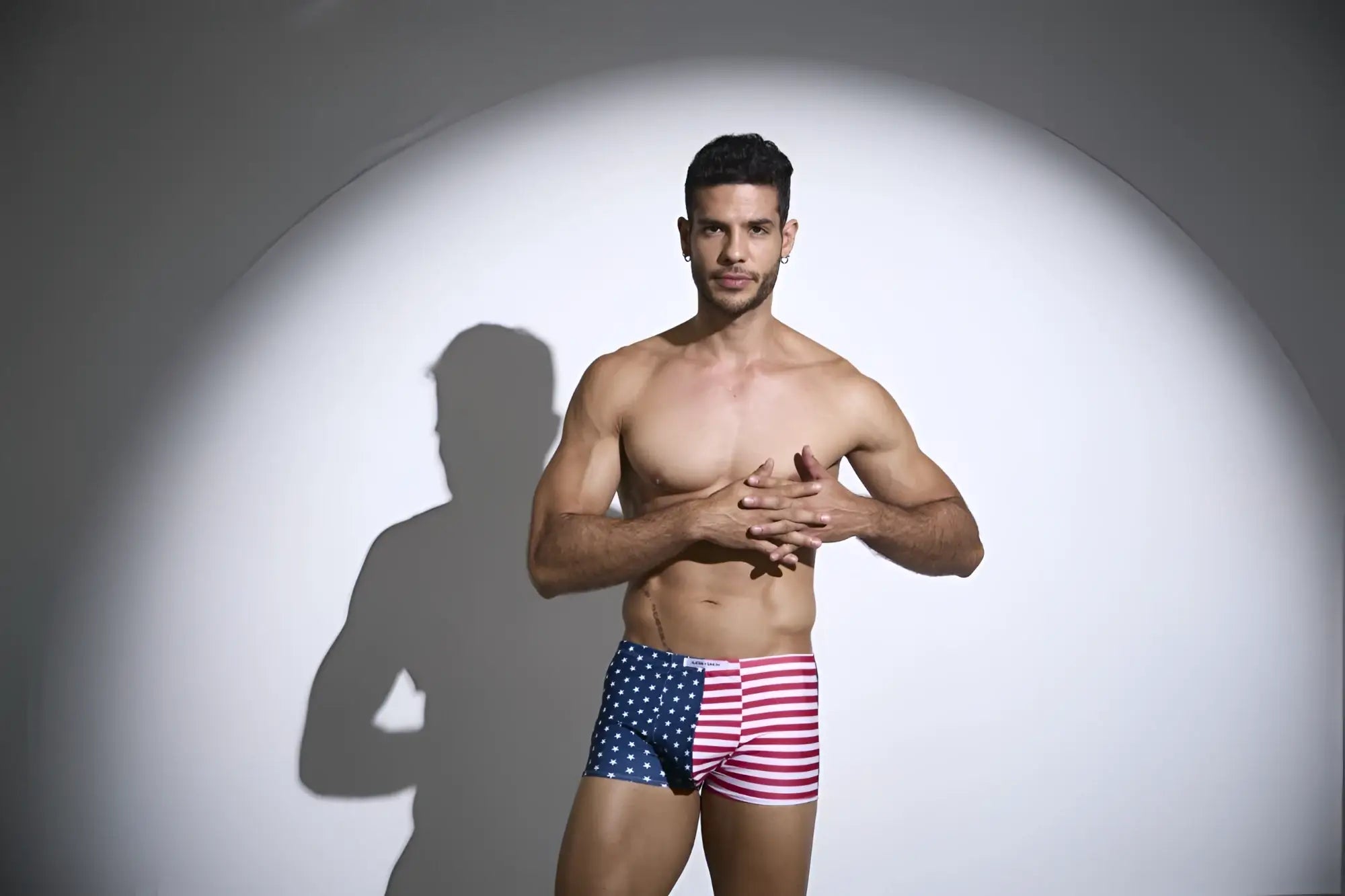 A man wearing justin simon xsj08 classic boxer briefs featuring american flag pattern with stars and stripes