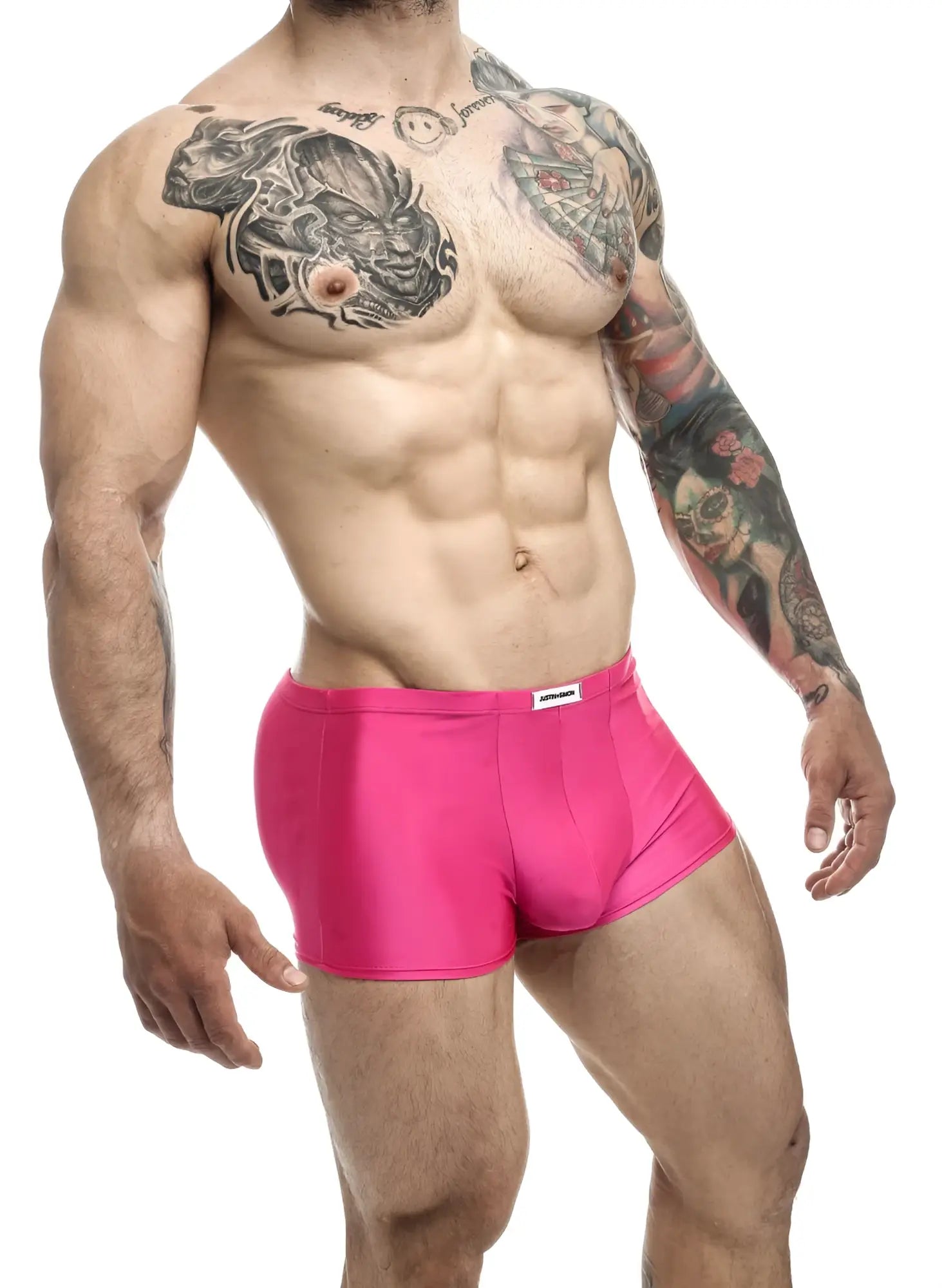 Bright pink form-fitting boxer briefs with white justin+simon brand tag at waistband classic trunks xsj08 model