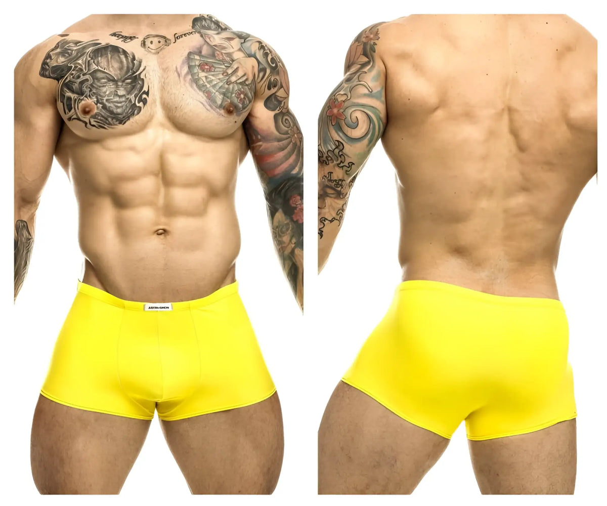 Bright yellow form-fitting men’s briefs with a small white brand tag at the waistband by JUSTIN+SIMON XSJ08 Classic Trunks