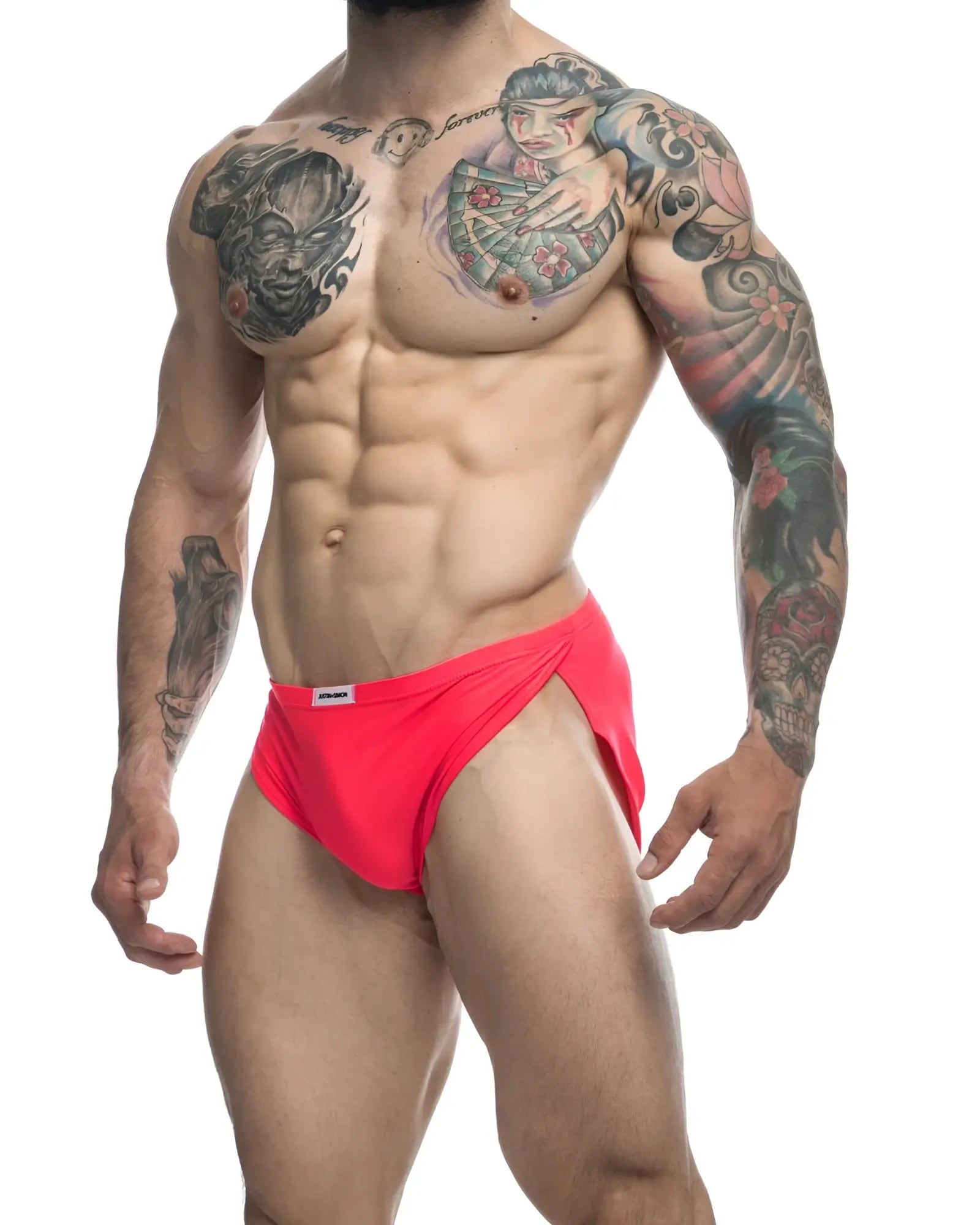 Bright red coral justin simon XSJ09 form-fitting swim trunks with a small white brand tag on the waistband