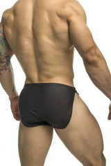Black justin simon xsj09 form-fitting swim trunks with sleek smooth material and subtle side slit