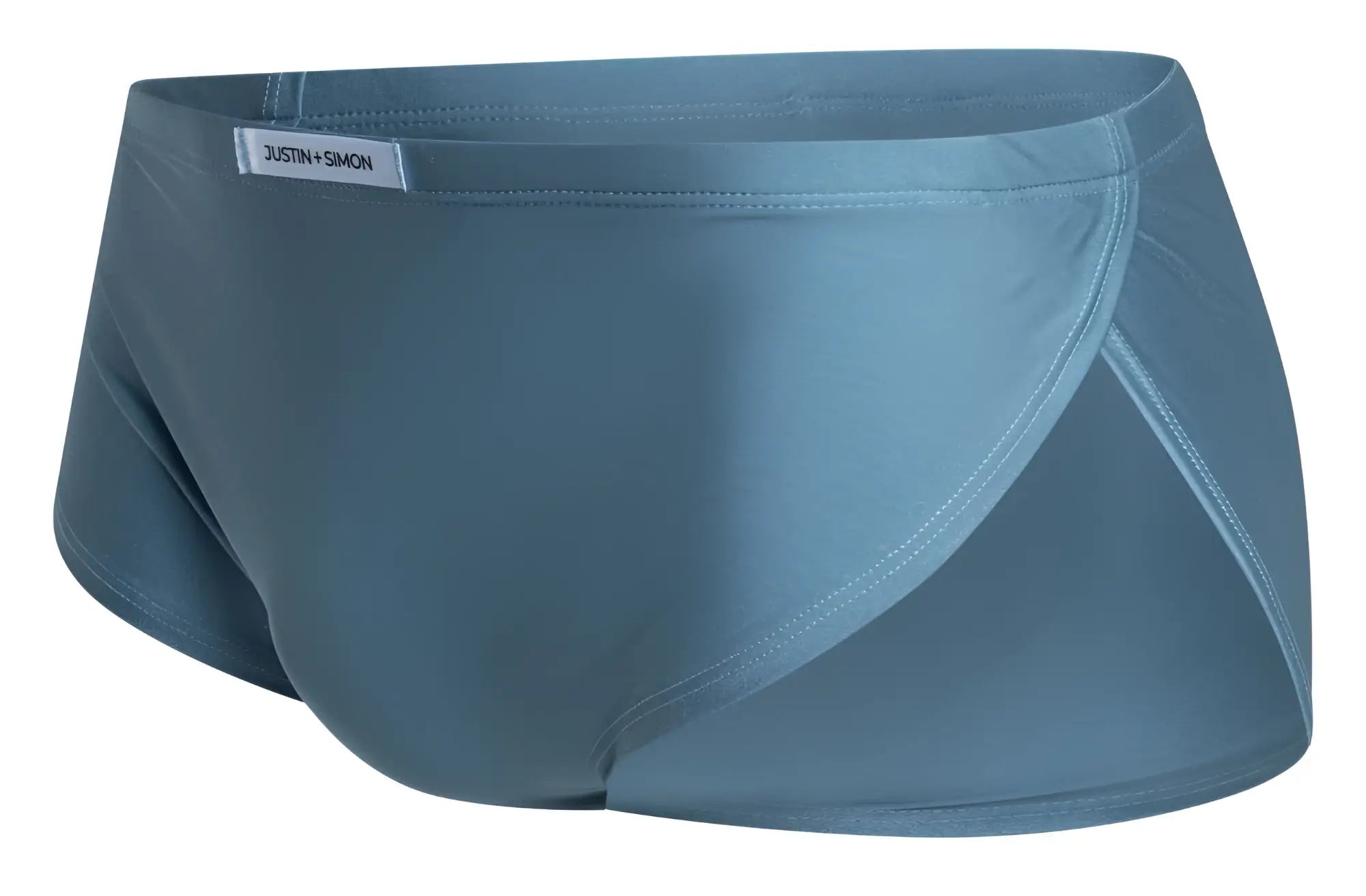 Teal-colored sleek men’s briefs by justin simon in metal green designed for running and active wear