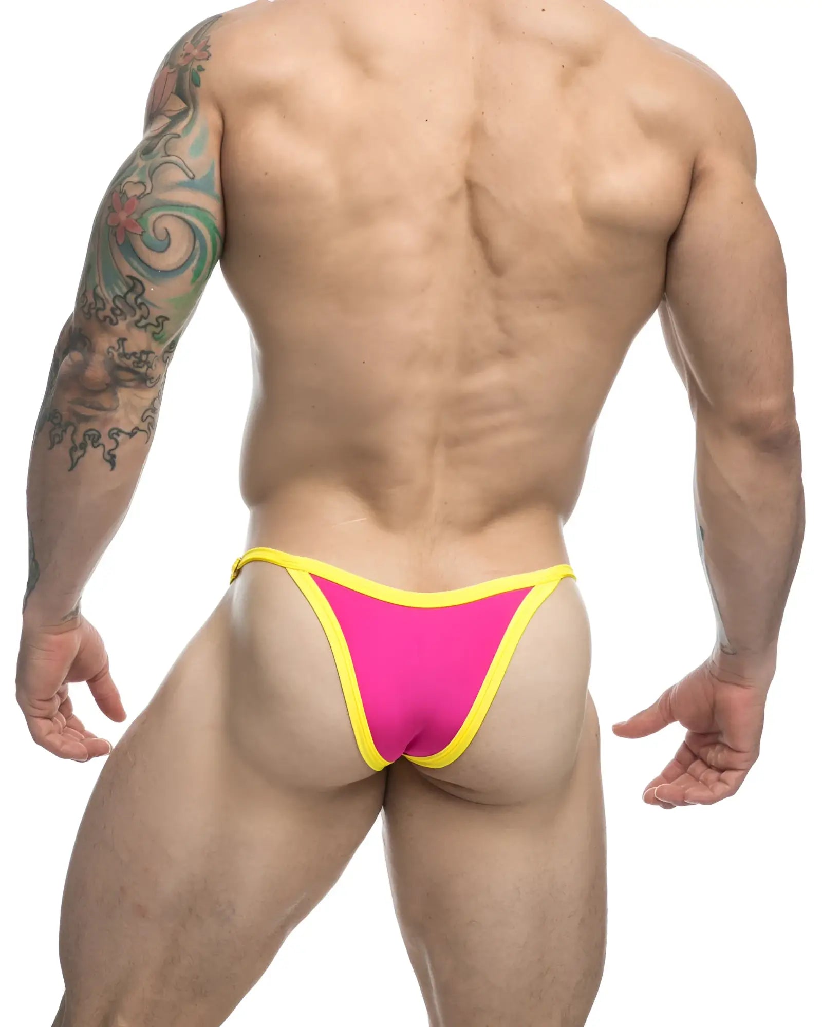 Bright pink and yellow justin simon xsj12 bikini thong with snug form-fitting design shown from the back side