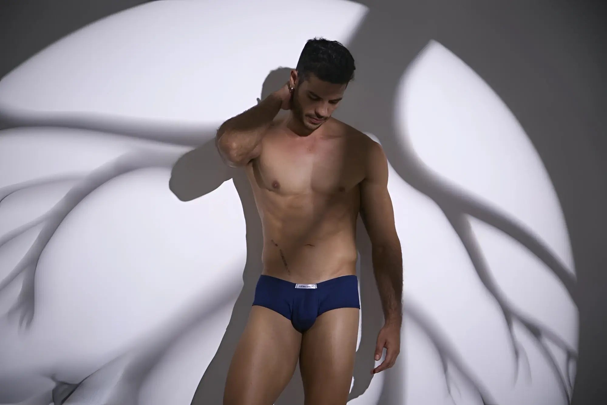 Navy blue cheeky bulge boxer briefs with a small white logo on the waistband from JUSTIN+SIMON XSJ13
