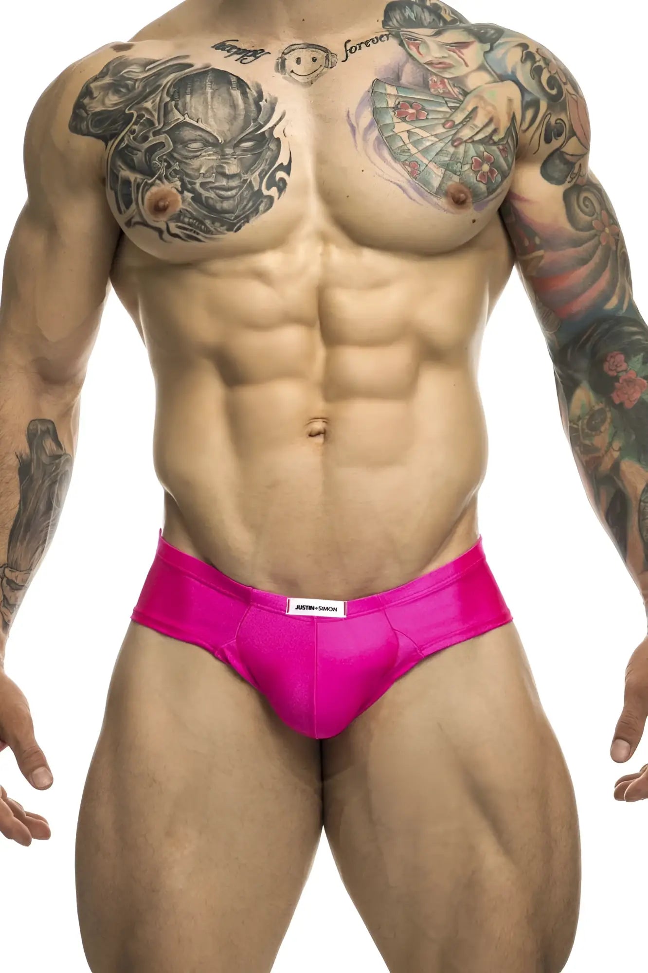 Bright pink sleek fabric cheek briefs with white justin simon brand label at the waistband