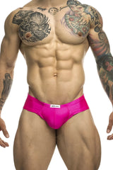 Bright pink sleek fabric cheek briefs with white justin simon brand label at the waistband