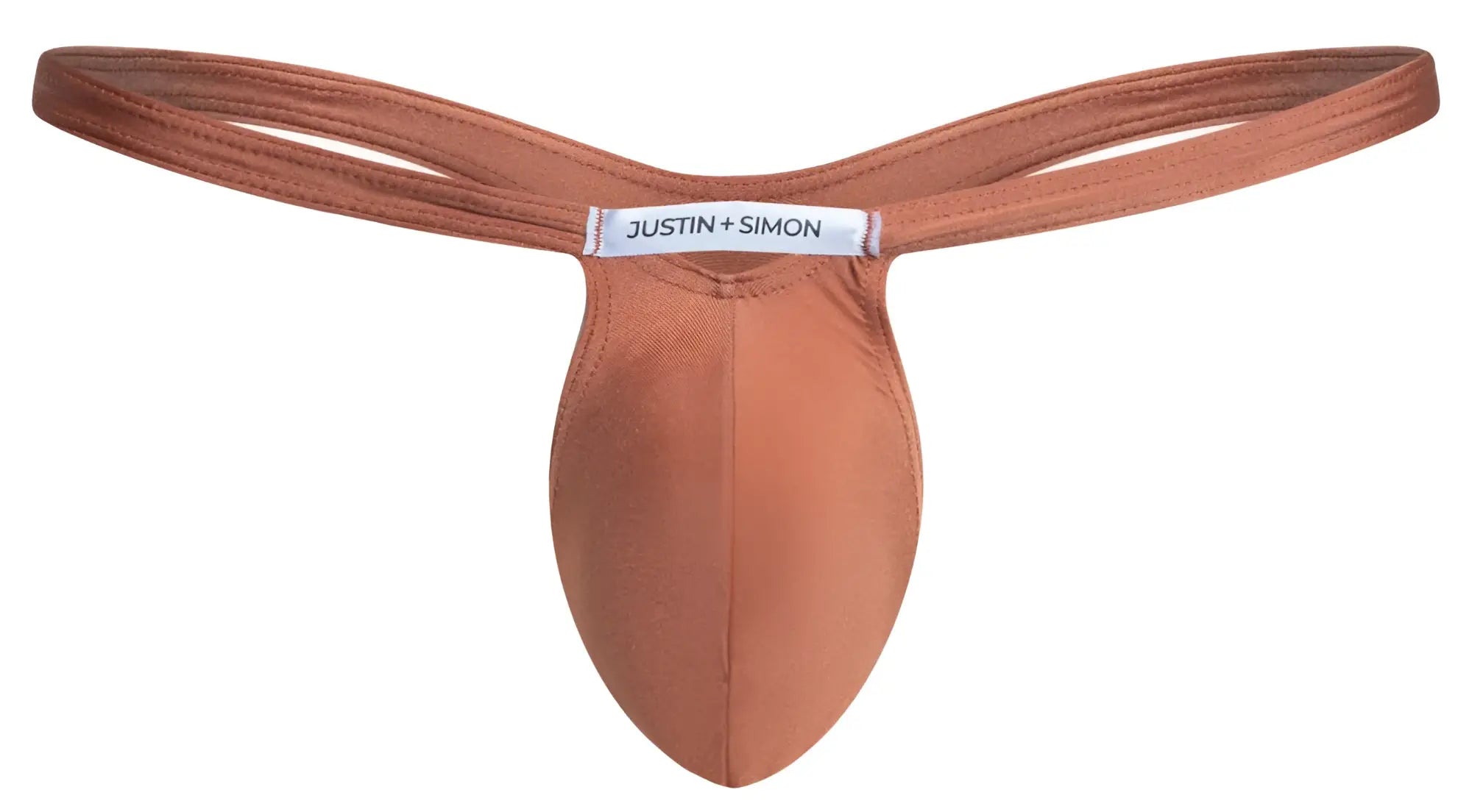 A rust-colored seamless thong made of soft fabric with a justin + simon label in ochre color