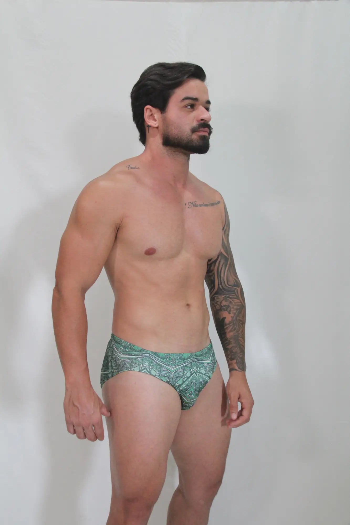Kaleidoscope swim brief green patterned swim trunks with intricate geometric designs for beachwear