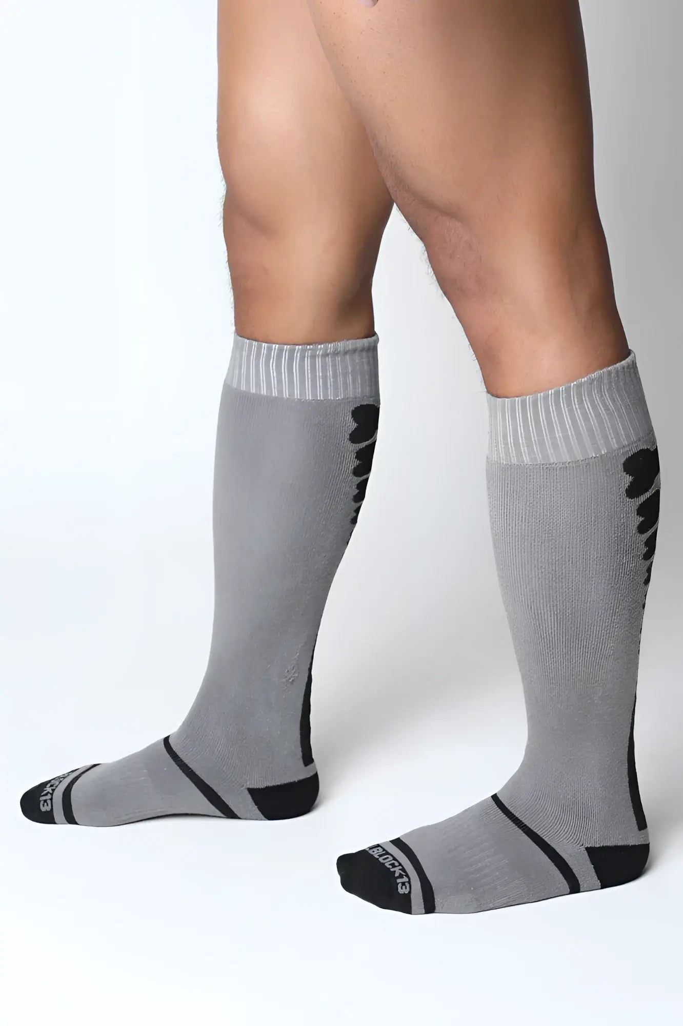 Kennel club bones knee high socks in gray with black accents ribbed cuffs and subtle textured pattern