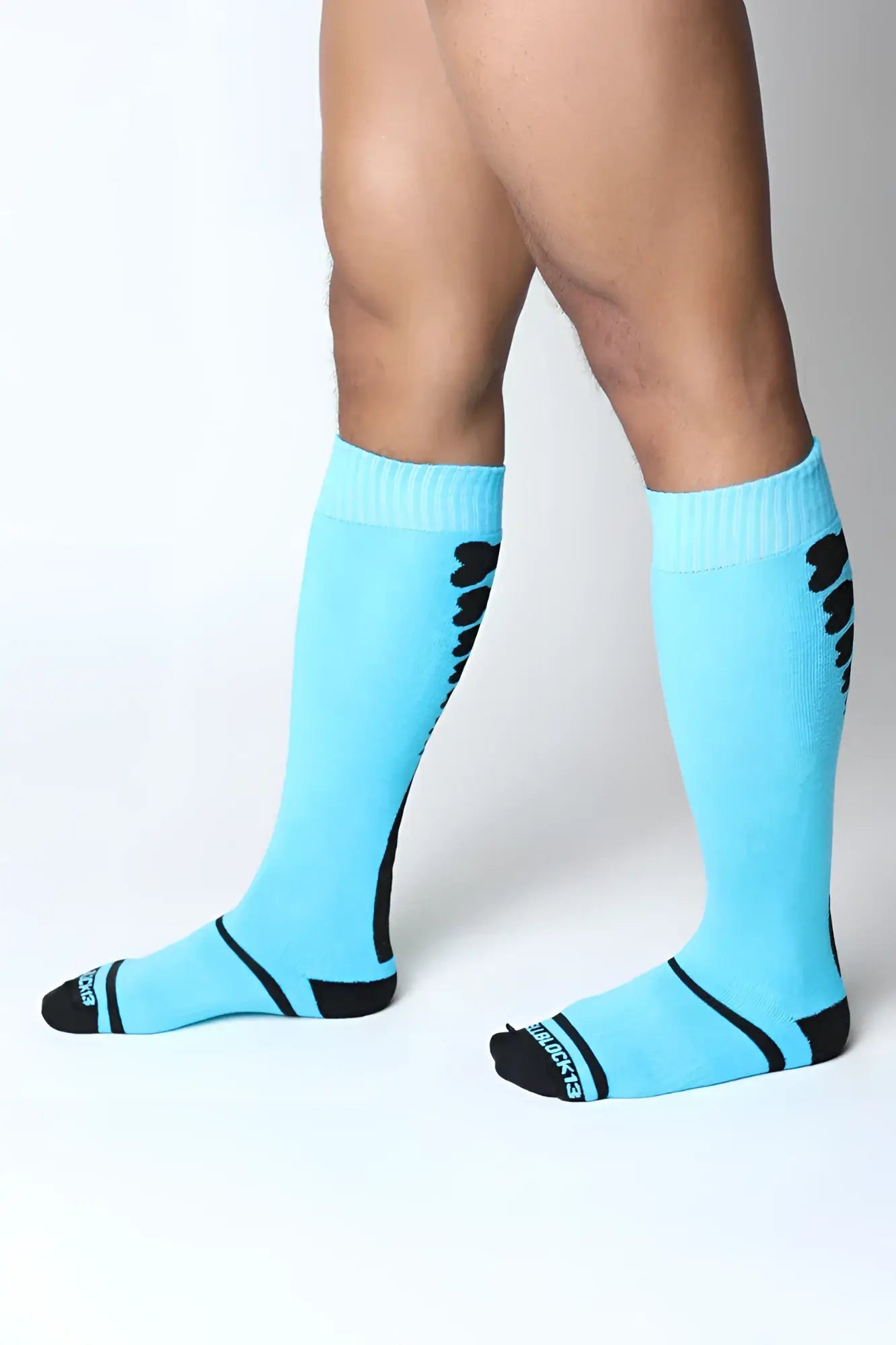 Light blue kennell club bones knee high socks with black accents ribbed cuff and skechers logo on the toe