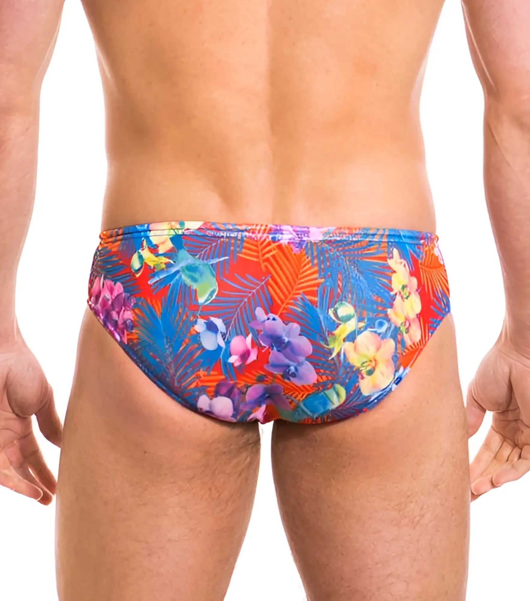 Vibrant tropical floral patterned kiniki continental tan through deep waist bikini swim trunks in red blue and purple hues size s