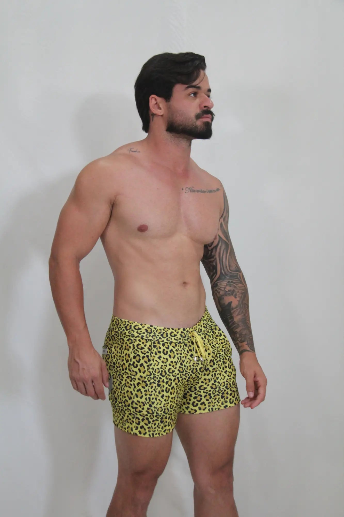 Bright yellow leopard fleece short swim trunks with a drawstring waistband for comfortable wear