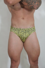 Bright yellow leopard-print swim brief made of stretchy material for comfortable beach and pool wear