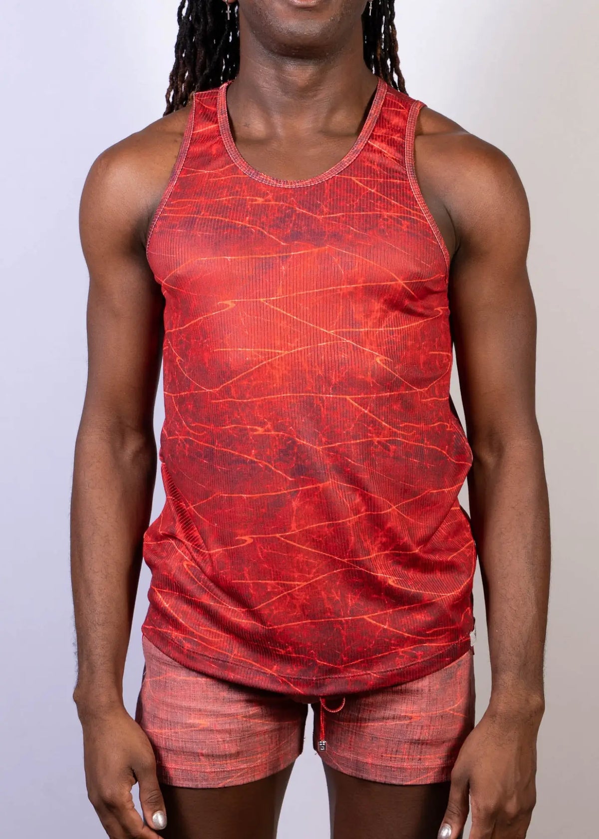 Red lightning print tank with a textured crackled pattern and subtle vertical ribbing in a tank top design