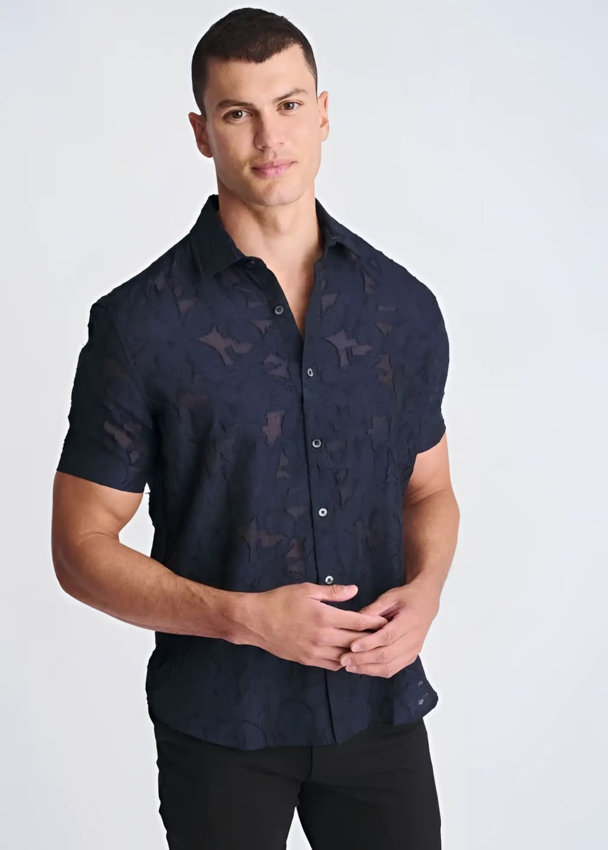 Lightweight dark navy short-sleeved button-up shirt with subtle textured jacquard pattern perfect for warm weather