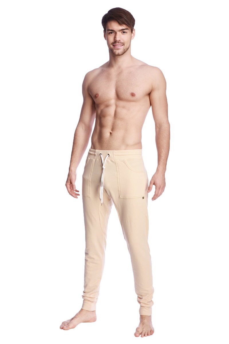 Long cuffed jogger and yoga sweat pants in sand beige with drawstring waistband and side pockets for comfort and style