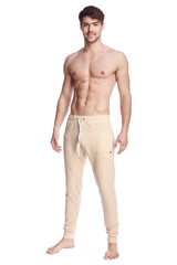 Long cuffed jogger and yoga sweat pants in sand beige with drawstring waistband and side pockets for comfort and style