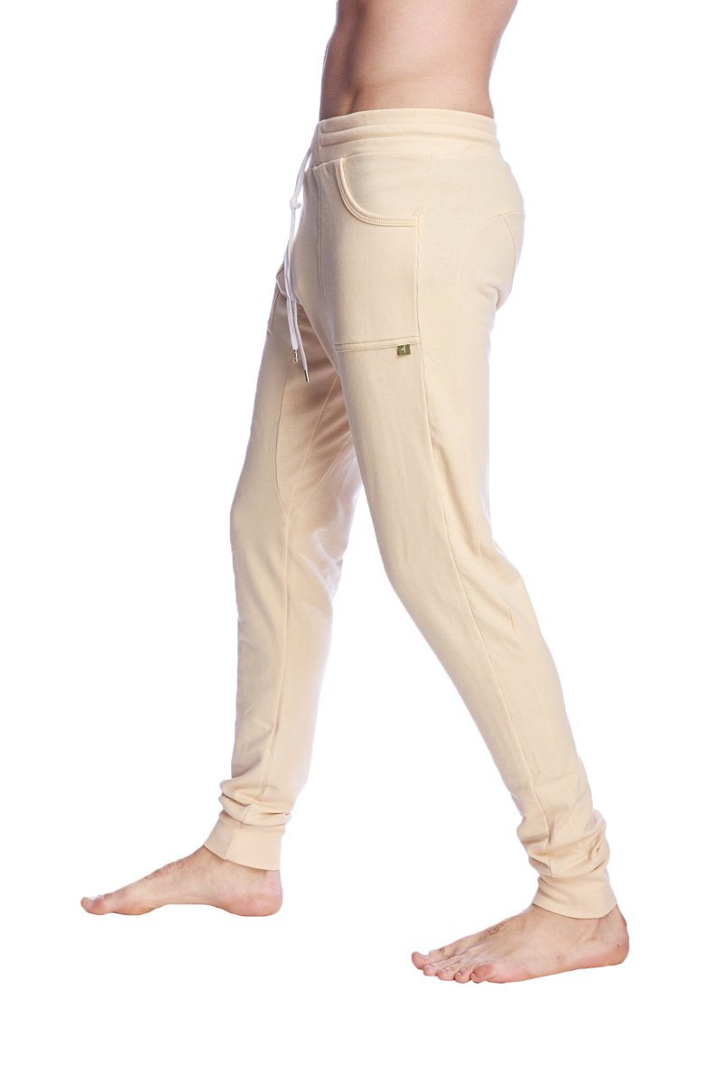 Beige long cuffed jogger and yoga sweat pants with drawstring waistband and elastic cuffs for comfort and style