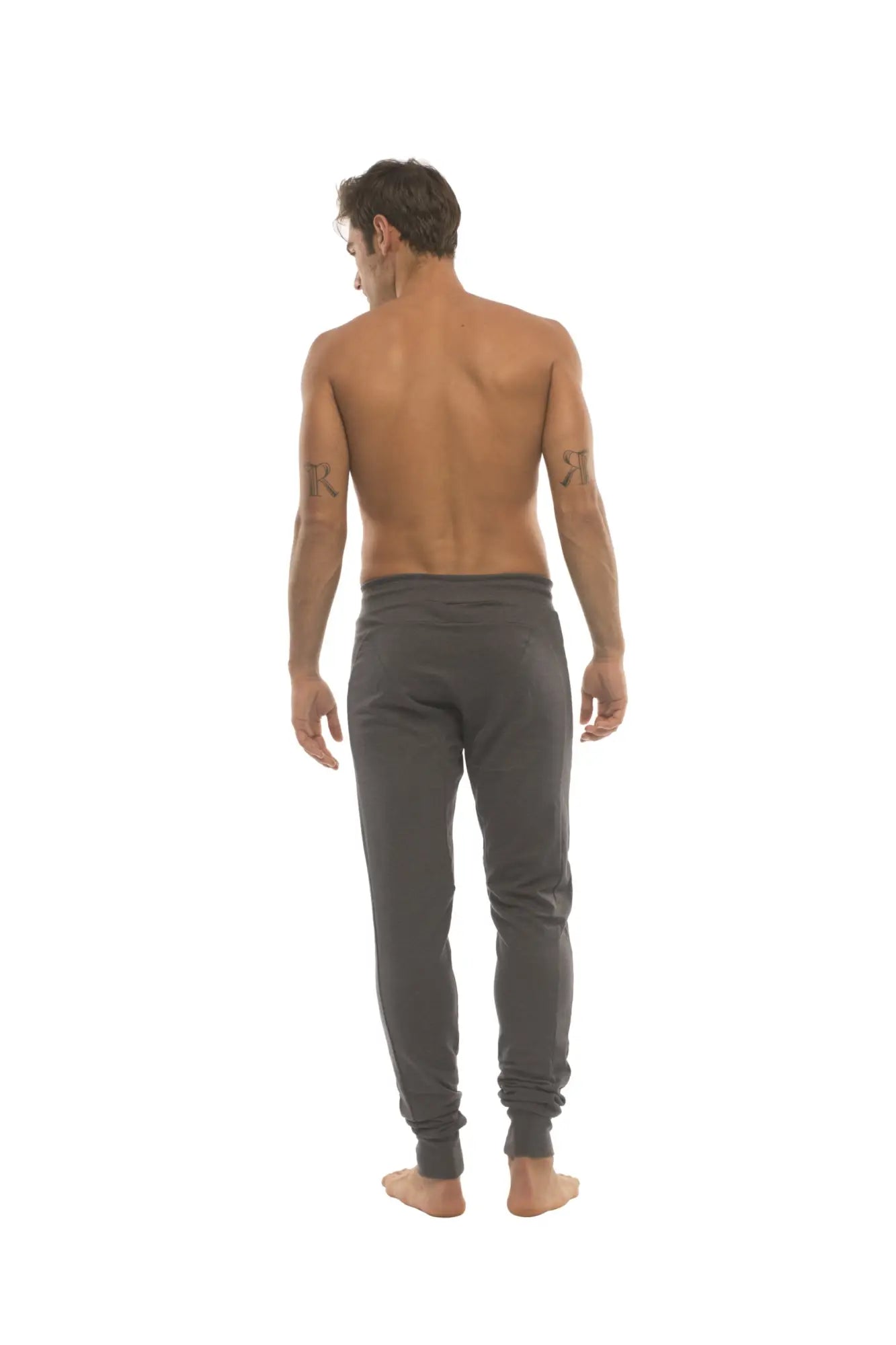 Dark gray slim-fit long cuffed jogger and yoga sweat pants made of soft fabric with tapered legs for athletic use