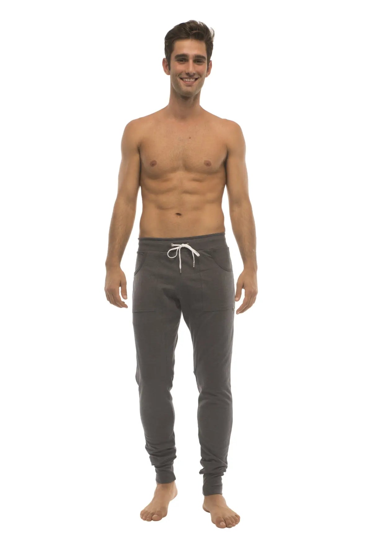Long cuffed jogger and yoga sweat pants in charcoal with white drawstring waistband and elastic cuffs