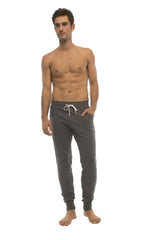Long cuffed jogger and yoga sweat pants in charcoal with white drawstring waistband and elastic cuffs