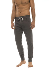 Dark gray long cuffed jogger and yoga sweat pants with white drawstring waistband and elastic cuffs