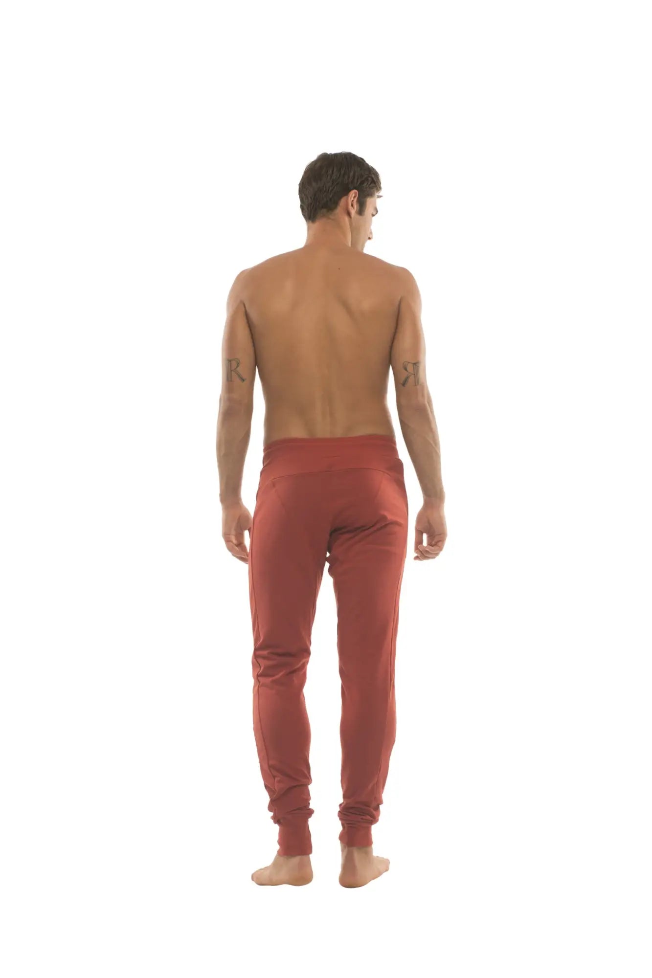 Long cuffed jogger and yoga sweat pants in cinnabar red featuring a high waistband and tapered legs