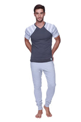 Men’s gray and white striped raglan sleeve v-neck t-shirt paired with long cuffed heather grey jogger and yoga sweat pants