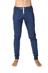 Long cuffed jogger and yoga sweat pants in royal blue with white drawstring waistband and elastic cuffs