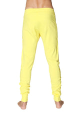 Long cuffed jogger and yoga sweat pants in bright tropic yellow soft fabric with relaxed fit and ruched cuffs