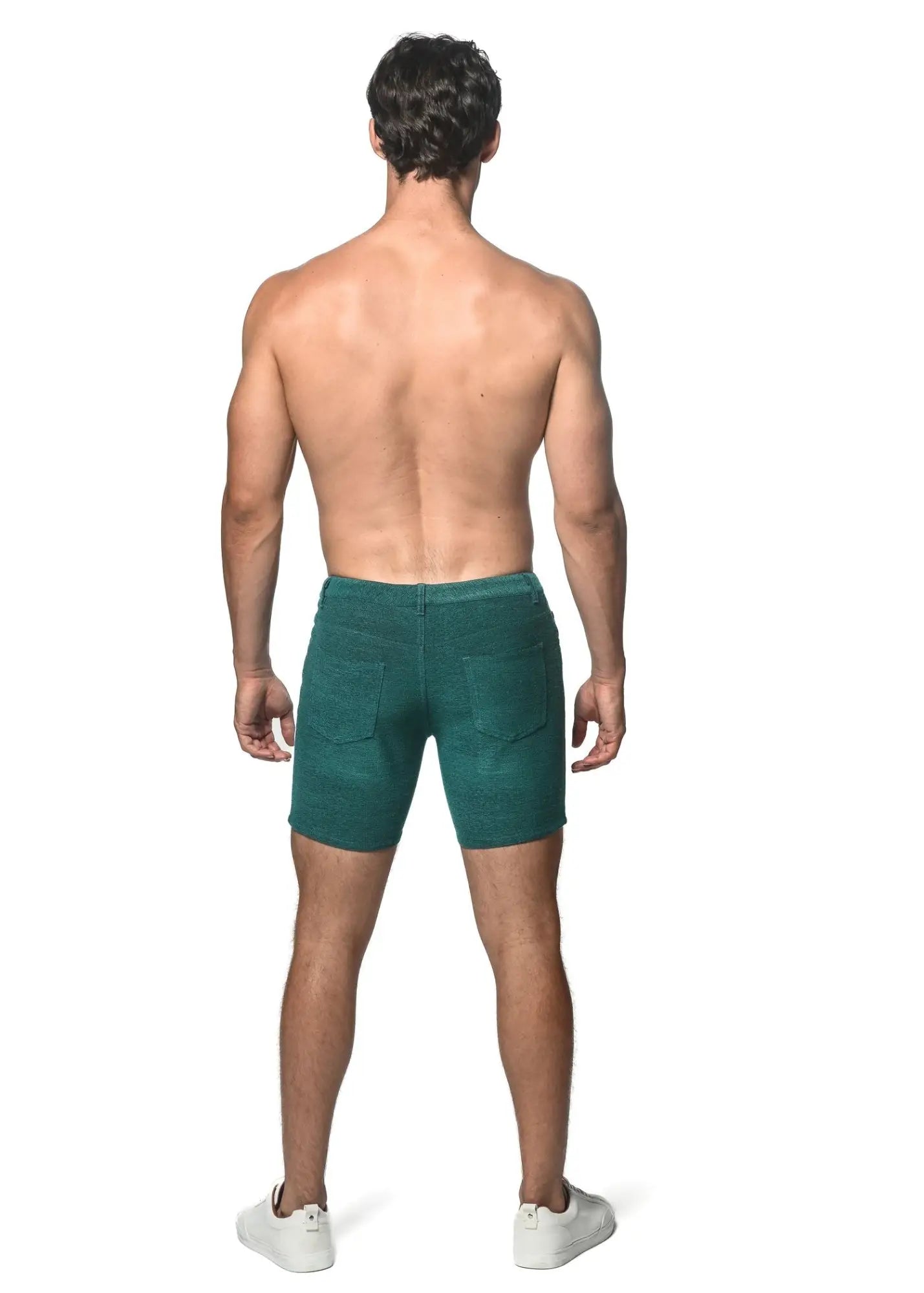 Dark green loopback stretch knit shorts featuring classic five-pocket design in denim material