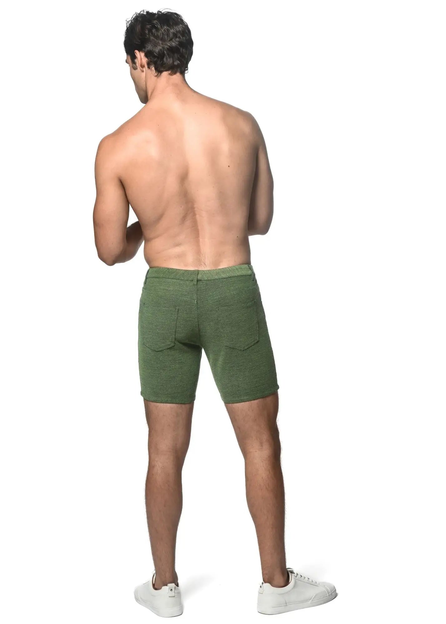 Rear view of olive green loopback stretch knit shorts with textured fabric and rear pockets