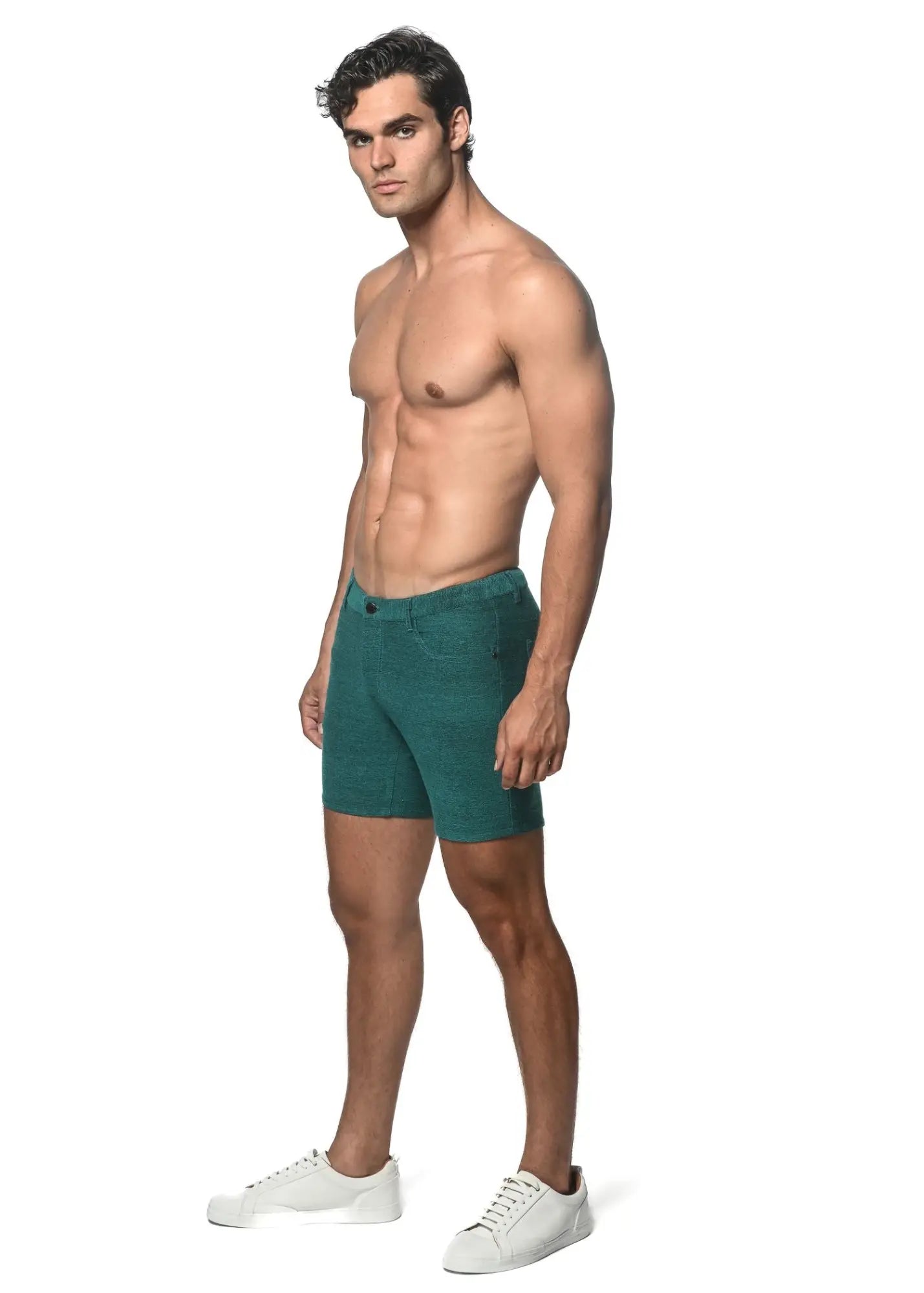 Teal slim-fit loopback stretch knit shorts made of textured fabric with visible stitching and belt loops