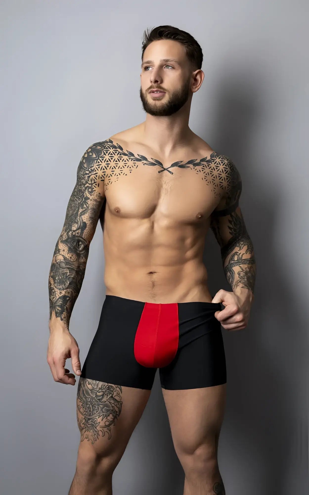 Male Power 154-300 hot mesh black and red athletic briefs with a bold vertical red pouch panel on the front