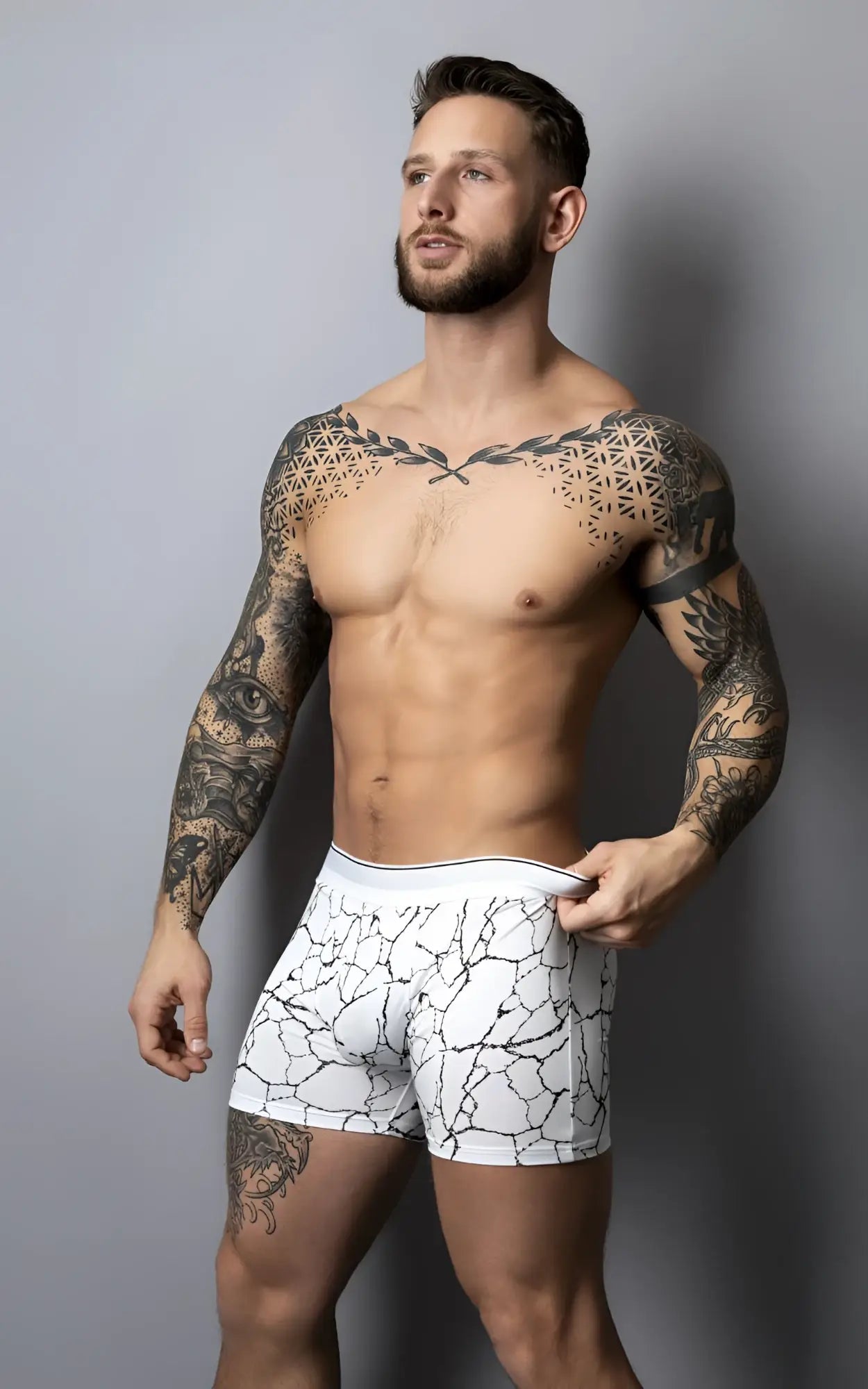 White boxer briefs with black crackle pattern and solid white waistband from male power soo cumfy collection