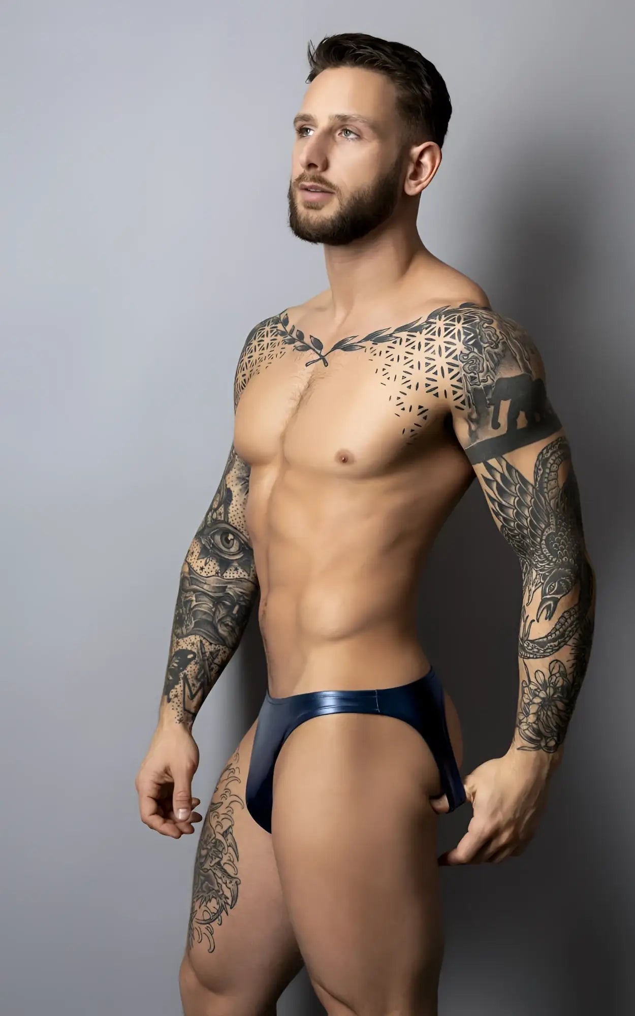 A sleek deep blue metallic Male Power 300-301 Liquid Onyx 2.0 brief with glossy finish and contoured design