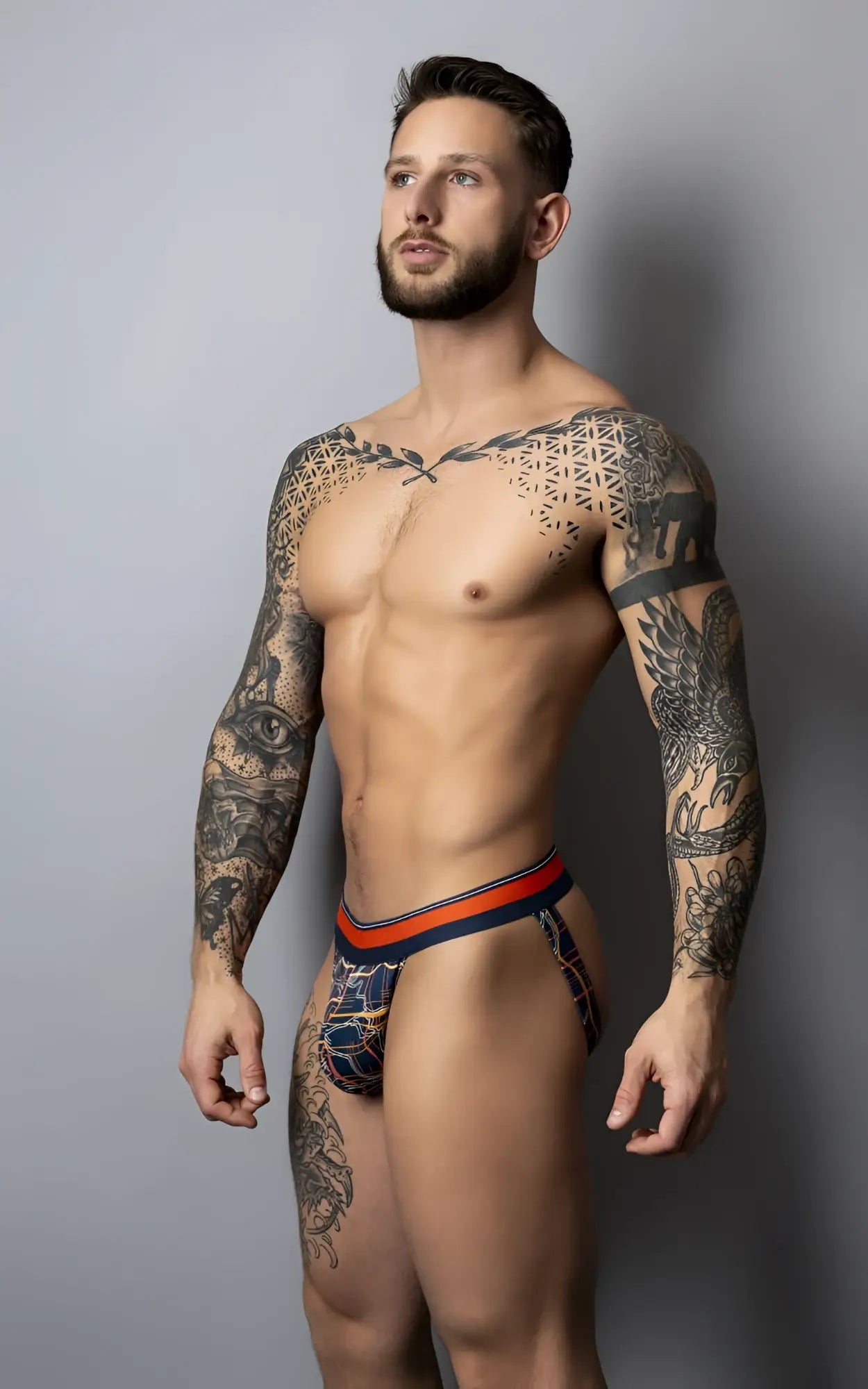Men’s briefs by Male Power in navy and orange with geometric patterns designed for comfort and style