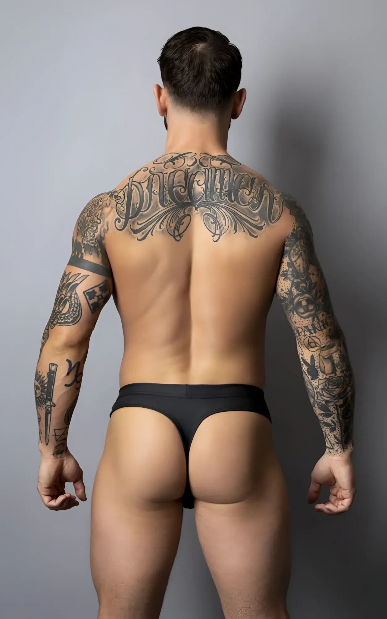 Black male power 410-298 oh snap snap off thong briefs with snug form-fitting design shown from the back side