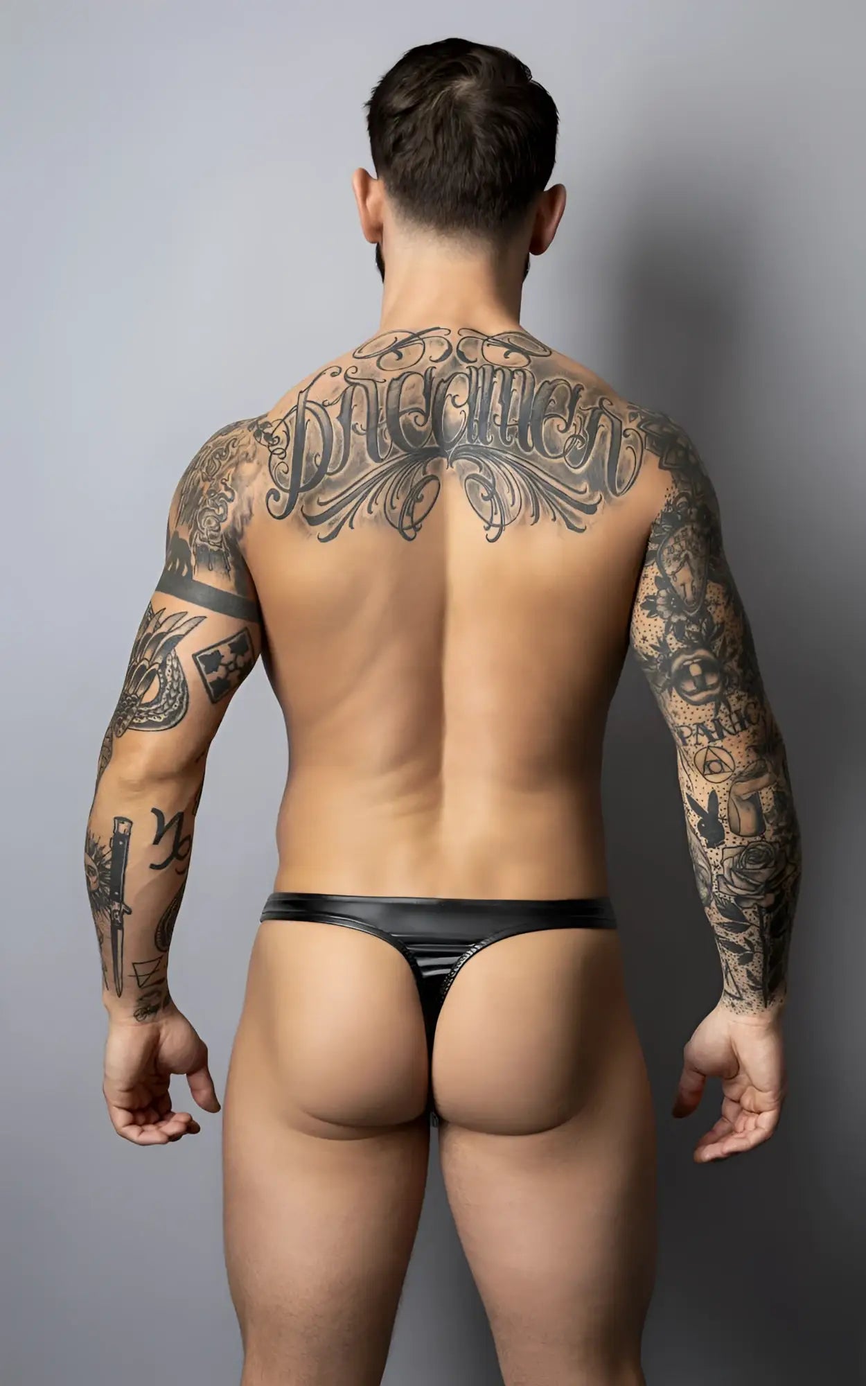 Male power 442-301 liquid onyx 2.0 black thong made of glossy black patent leather with a shiny finish